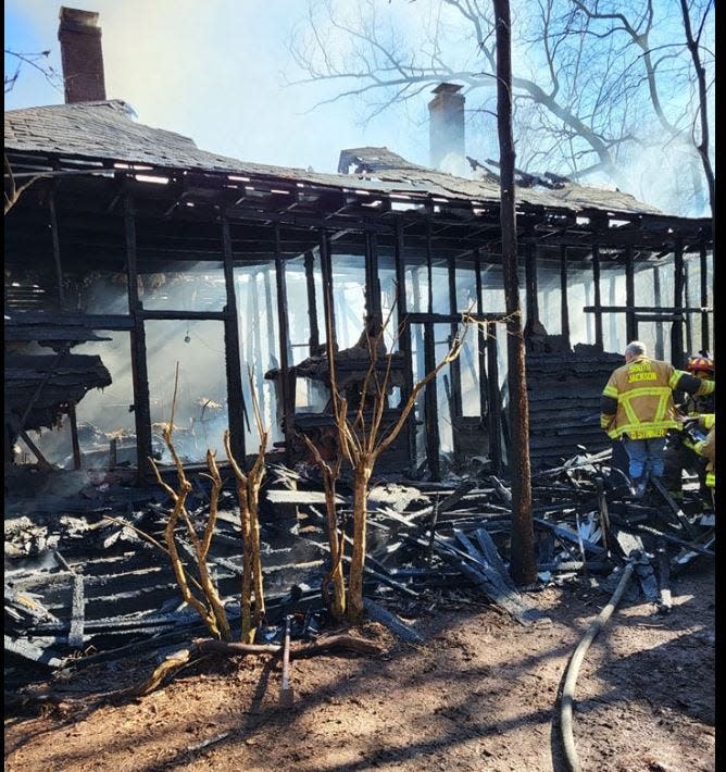 A man died in this house fire in Jackson County, but a woman and her son were rescued by passing motorists.
