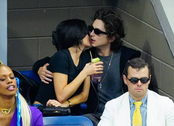 Kylie Jenner and Timothée Chalamet going in for a kiss in the stands of the US Open