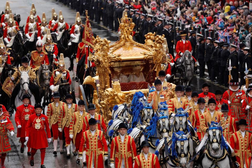 The King and Queen leave Westminster Abbey in the Gold State Coach