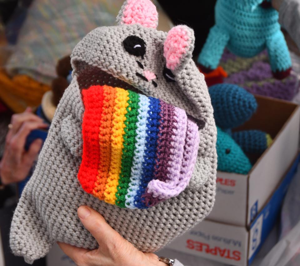 Some of the items were crocheted toys for veteran's children, inlcuding a cat coughing up a rianbow.