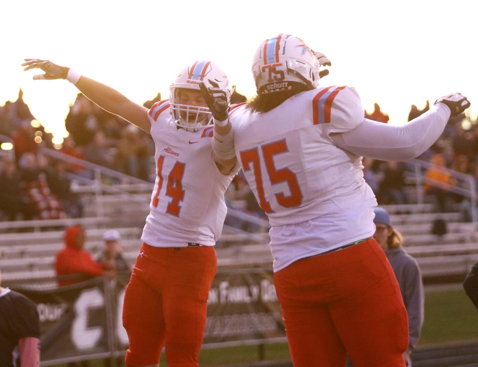 Alliance's Carter Bugara, left, and Jaezen Lewis (75) celebrate after Bugara's touchdown at Carrollton, Friday, Sept. 30, 2022.