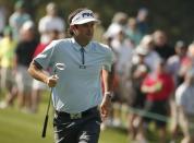 Bubba Watson of the U.S. makes his way up onto the third green during first round play of the Masters golf tournament at the Augusta National Golf Course in Augusta, Georgia April 9, 2015. REUTERS/Phil Noble