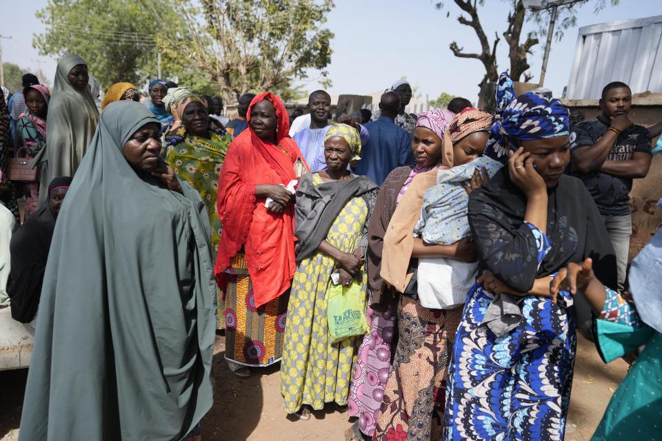 People queue to cast their votes during the presidential and parliamentary elections in Yola, Nigeria, Saturday, Feb. 25, 2023. Voters in Africa's most populous nation are heading to the polls Saturday to choose a new president, following the second and final term of incumbent Muhammadu Buhari. (AP Photo/Sunday Alamba)