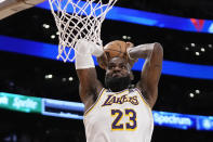 Los Angeles Lakers forward LeBron James dunks during the second half in Game 4 of an NBA basketball first-round playoff series against the Denver Nuggets Saturday, April 27, 2024, in Los Angeles. (AP Photo/Mark J. Terrill)