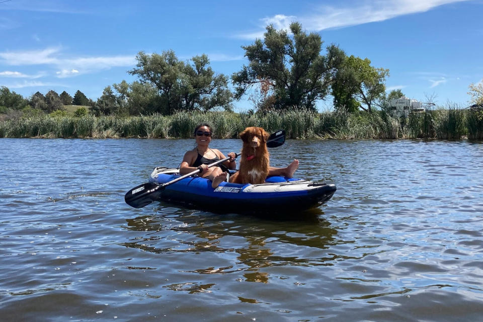 The author enjoying a river trip with her pup; (photo/Michelle de Leon)