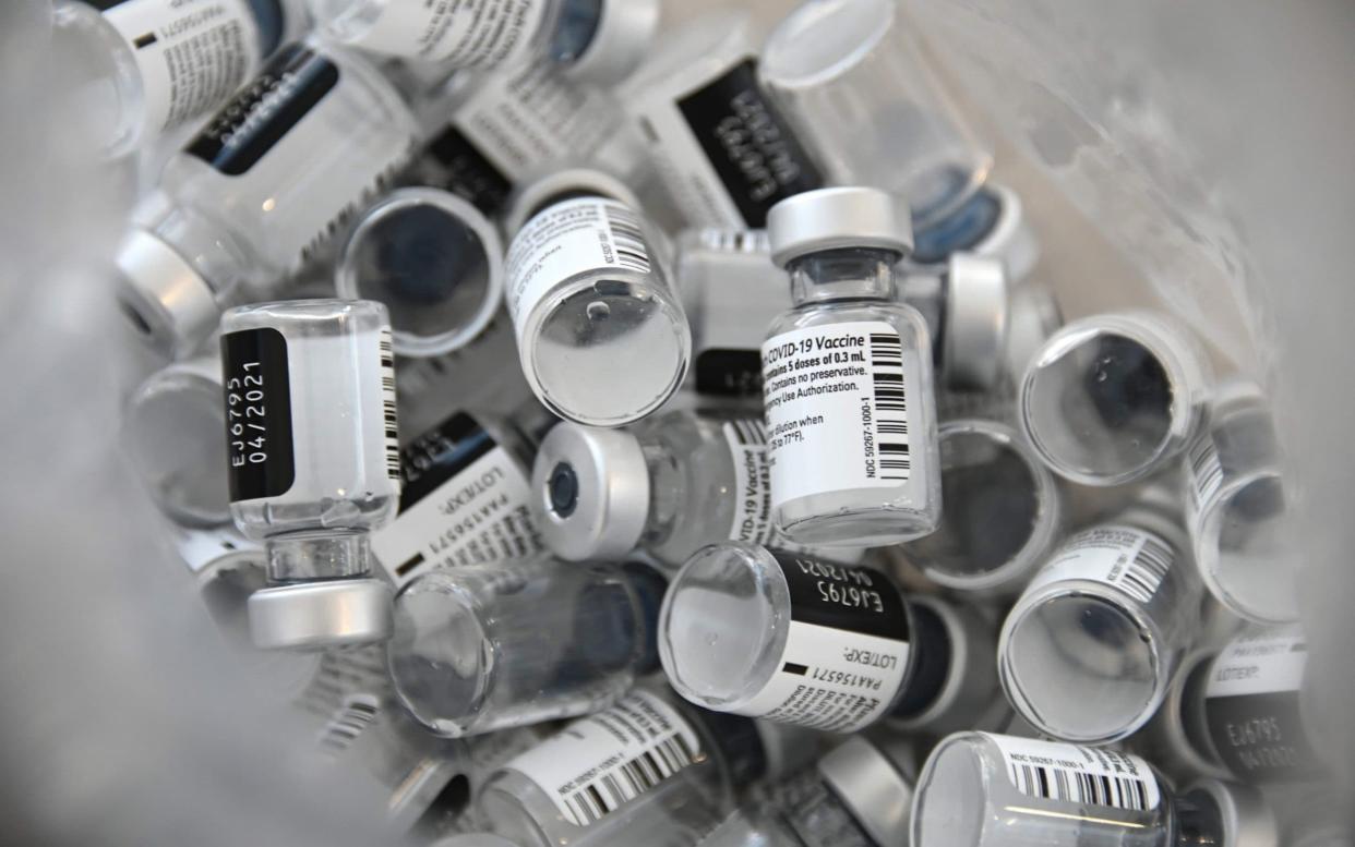 Empty bottles of Pfizer-BioNTech Covid-19 vaccine - AFP