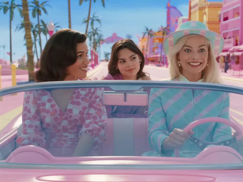 America Ferrera as Gloria, Ariana Greenblatt as Sasha, and Margot Robbie as Barbie in "Barbie."