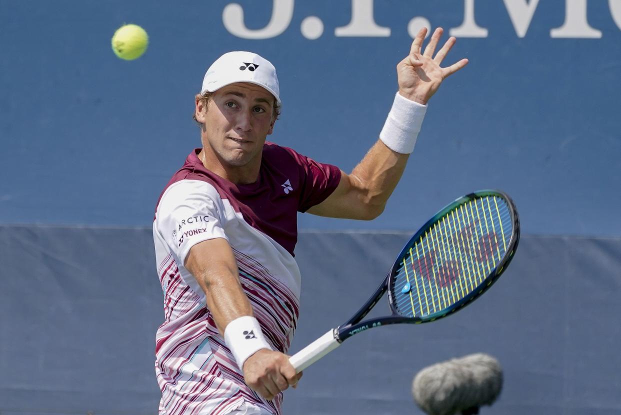 Casper Ruud, of Norway, returns a shot to Kyle Edmund, of Great Britain, during the first round of the U.S. Open tennis championships, Monday, Aug. 29, 2022, in New York.