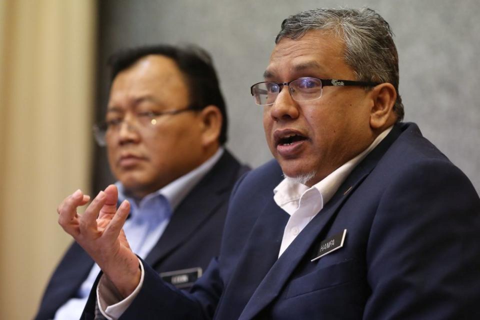 Deputy Minister in the Prime Minister's Department Mohamed Hanipa Maidin speaks during a media conference on fake news in Putrajaya February 21, 2020. — Picture by Yusof Mat Isa