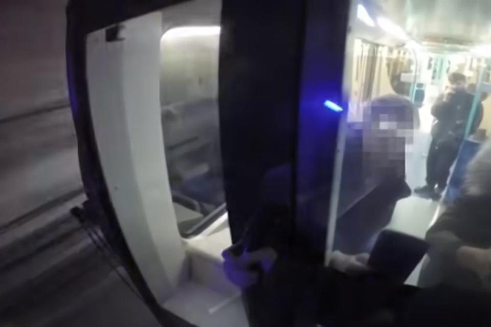 The foolish train surfer held on to the front of the DLR service as it hurtled through the tunnel (YouTube)