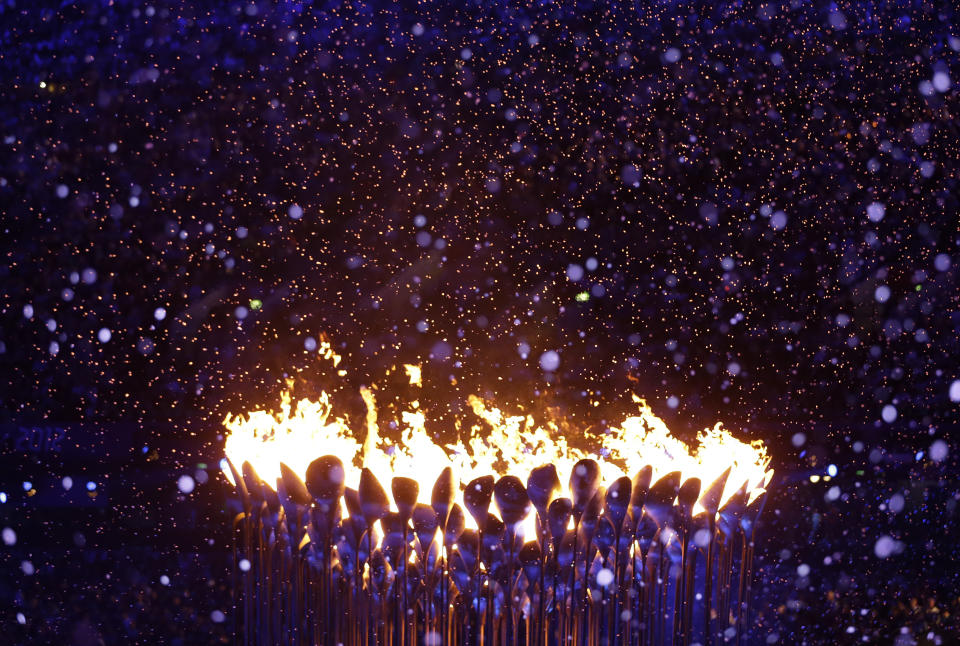 Confetis floats down past the Paralympic flam during the closing ceremony for the   2012 Paralympics games, Sunday, Sept. 9, 2012, in London. (AP Photo/Lefteris Pitarakis)