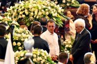 Italian President Sergio Mattarella (R) was vibibly shaken at the funeral, speaking of an "unacceptable tragedy"