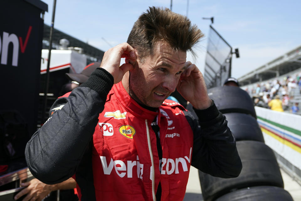 FILE _ Will Power, of Australia, talks with a crew member following practice for the Indianapolis 500 auto race at Indianapolis Motor Speedway, Monday, May 22, 2023, in Indianapolis. Power said Thursday, April 25, 2024, he was unaware of any manipulations to Team Penske’s push-to-power system until after last weekend’s IndyCar race at Long Beach and never illegally used the mechanism.. Power finished fourth and while his result was not thrown out, he was docked 10 points and all three Penske drivers were fined $25,000. (AP Photo/Darron Cummings, File)