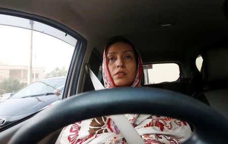 Aasia Abdul Aziz, one of the pioneer women drivers of Careem, drives her car in Karachi, Pakistan December 6, 2016. Picture taken December 6, 2016. REUTERS/Akhtar Soomro