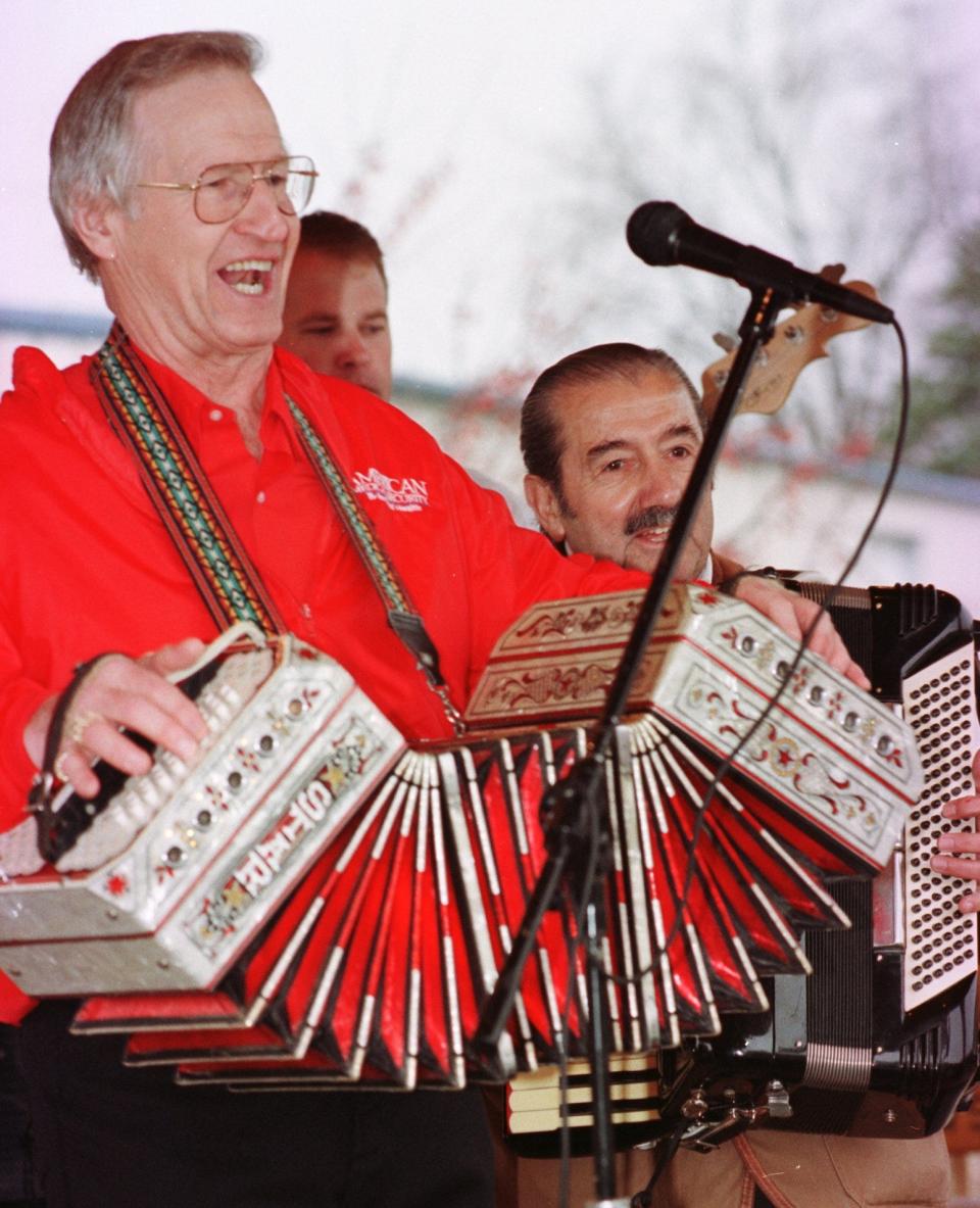 Alvin Styczynski, left, with Dick Metko and other musicians furnished polka music for the "hamburger helpers" on Oct. 27, 2000, at the new gazebo of the Seymour Hamburger Hall of Fame.