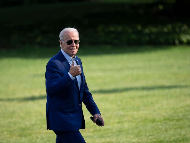 PHOTO: U.S. President Joe Biden gestures toward reporters as he departs Marine One and walks to the Oval Office on the South Lawn of the White House, July 20, 2022, in Washington. (Drew Angerer/Getty Images)