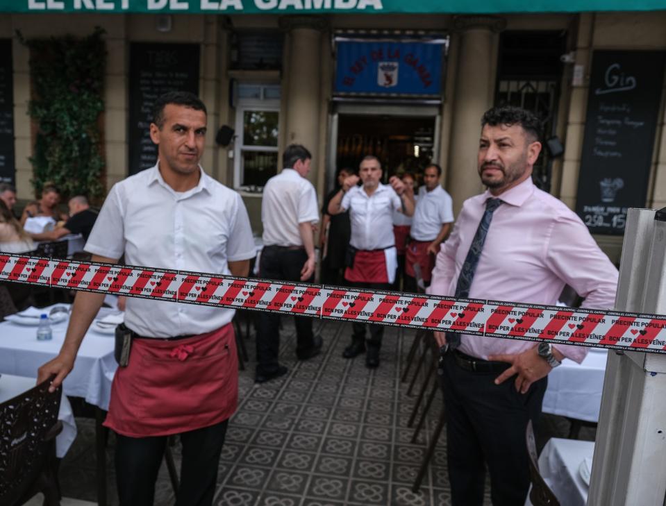 Workers at a restaurant in Barcelona are seen confronting protesters who have symbolically closed the establishment's terrace (Overtourism protest on July 6,2024)