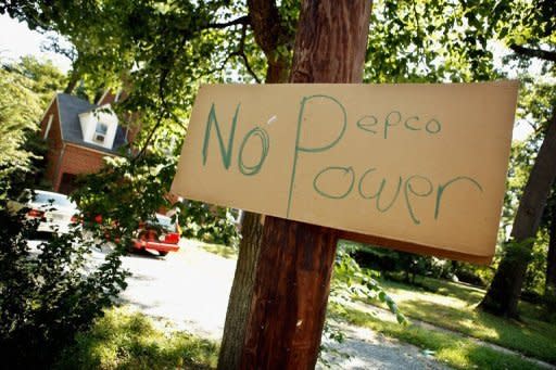 A hand-written sign about local power company Pepco hangs on a pole in a residential neighborhood on July 2 in Silver Spring, Maryland. More than a million customers in the storm-hit United States remained without power Wednesday, as canceled firework displays and no air-conditioning made for a miserable July 4 holiday for many Americans