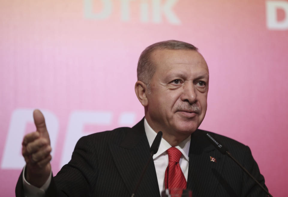 Turkey's President Recep Tayyip Erdogan addresses the World Turkish Business Council meeting, in Baku, Azerbaijan, Monday. Oct. 14, 2019. Erdogan says Turkey's military offensive into northeast Syria is as "vital" to Turkey as its 1974 military intervention in Cyprus, which split the island in two. (Presidential Press Service via AP, Pool)