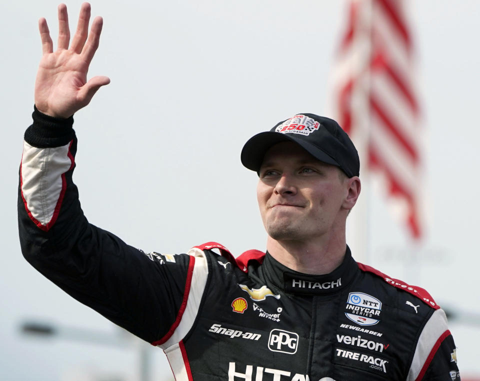 FILE - Josef Newgarden waves after winning the IndyCar Series auto race July 23, 2022, at Iowa Speedway in Newton, Iowa. The IndyCar season begins Sunday, March 5, 2023, with the Grand Prix of St. Petersburg. (AP Photo/Charlie Neibergall, File)