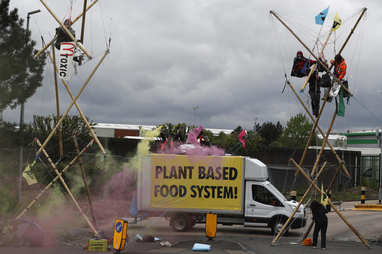 COVENTRY, ENGLAND - MAY 22: Animal rights protesters from Animal Rebellion blockade a McDonald's distribution centre to stop deliveries to the fast-food chain's 1,300 UK outlets on May 22, 2021 in Coventry, England. Animal Rebellion said about 50 activists were using trucks and bamboo structures to stop lorries leaving depots in Hemel Hempstead, Basingstoke, Coventry and Heywood, Greater Manchester.  (Photo by Darren Staples/Getty Images)