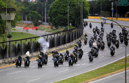 Riot security forces take position while clashing with demonstrators rallying against Venezuela's President Nicolas Maduro in Caracas, Venezuela, May 31, 2017. REUTERS/Christian Veron