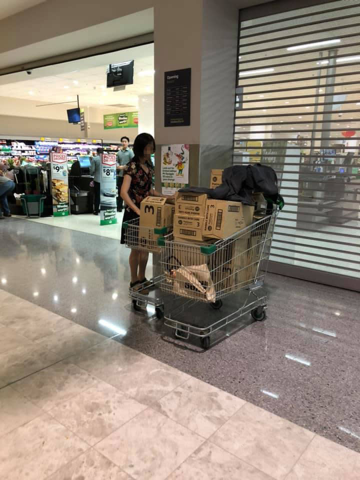 The shopper was spotted outside the Hurstville Woolworths with two trolleys filled to the edges with baby formula boxes. Source: Facebook/Jason Wu