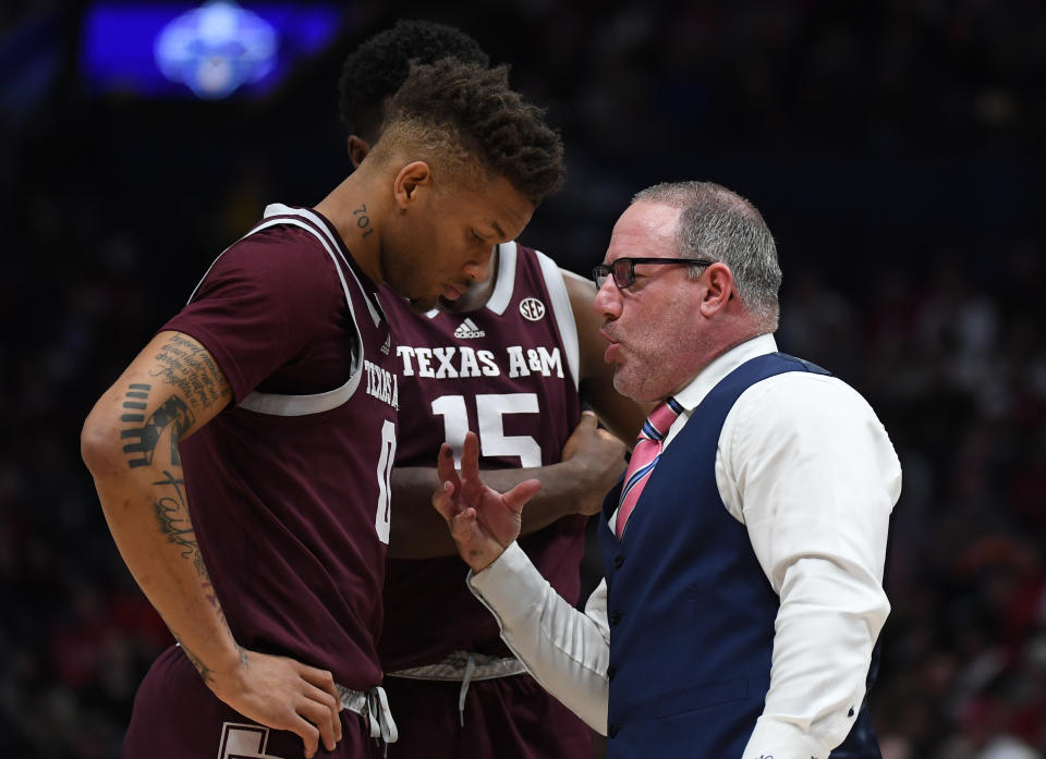 Mar 12, 2023; Nashville, TN; Texas A&M Aggies head coach Buzz Williams talks with guard Dexter Dennis (0) and forward Henry Coleman III (15) during a break in the second half against the Alabama Crimson Tide at Bridgestone Arena. Christopher Hanewinckel-USA TODAY Sports