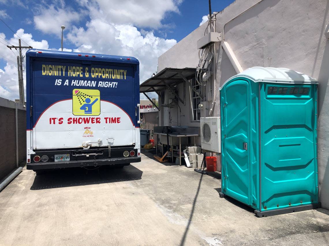 The Rescate church has provided a portable toilet and a shower truck to offer the homeless who live on the streets of Hialeah their weekly toilet