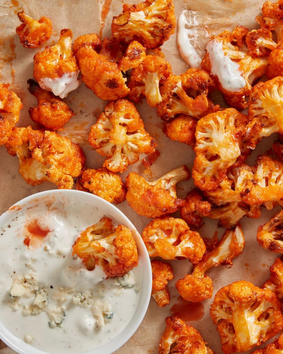 <p>This cauliflower is the perfect answer when you have <a href="https://www.delish.com/cooking/recipe-ideas/recipes/a51133/classic-buffalo-wings-recipe/" rel="nofollow noopener" target="_blank" data-ylk="slk:buffalo wings;elm:context_link;itc:0;sec:content-canvas" class="link ">buffalo wings</a> on the brain, but need to eat more vegetables. All the buffalo flavor you love coat these florets, which are then air-fried to perfection. It all comes together when you dip one into our perfectly creamy <a href="https://www.delish.com/cooking/recipe-ideas/a38768697/blue-cheese-dressing-recipe/" rel="nofollow noopener" target="_blank" data-ylk="slk:blue cheese dressing;elm:context_link;itc:0;sec:content-canvas" class="link ">blue cheese dressing</a> (but feel free to go with <a href="https://www.delish.com/cooking/recipe-ideas/a25634518/ranch-dressing-recipe/" rel="nofollow noopener" target="_blank" data-ylk="slk:ranch dressing;elm:context_link;itc:0;sec:content-canvas" class="link ">ranch dressing</a> if you prefer!). </p><p>Get the <strong><a href="https://www.delish.com/cooking/recipe-ideas/a38327266/air-fryer-buffalo-cauliflower-recipe/" rel="nofollow noopener" target="_blank" data-ylk="slk:Air Fryer Buffalo Cauliflower recipe;elm:context_link;itc:0;sec:content-canvas" class="link ">Air Fryer Buffalo Cauliflower recipe</a></strong>.</p>