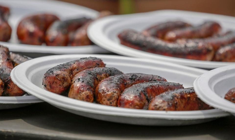 Brats await brat eating contestants during Brat Days at Kiwanis Park, Saturday, August 7, 2021, in Sheboygan, Wis.