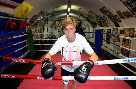 Tennis player Russia's Andrey Rublev, who next plays Britain's Andy Murray in the second round, stands in a boxing ring during a visit to the Fight Club boxing gymnasium during a promotional event for the Australian Open tennis tournament in this handout image taken on January 17, 2017. Fiona Hamilton/Courtesy of Tennis Australia/Handout via REUTERS