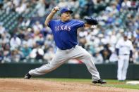 May 16, 2018; Seattle, WA, USA; Texas Rangers starting pitcher Bartolo Colon (40) throws against the Seattle Mariners during the third inning at Safeco Field. Mandatory Credit: Joe Nicholson-USA TODAY Sports