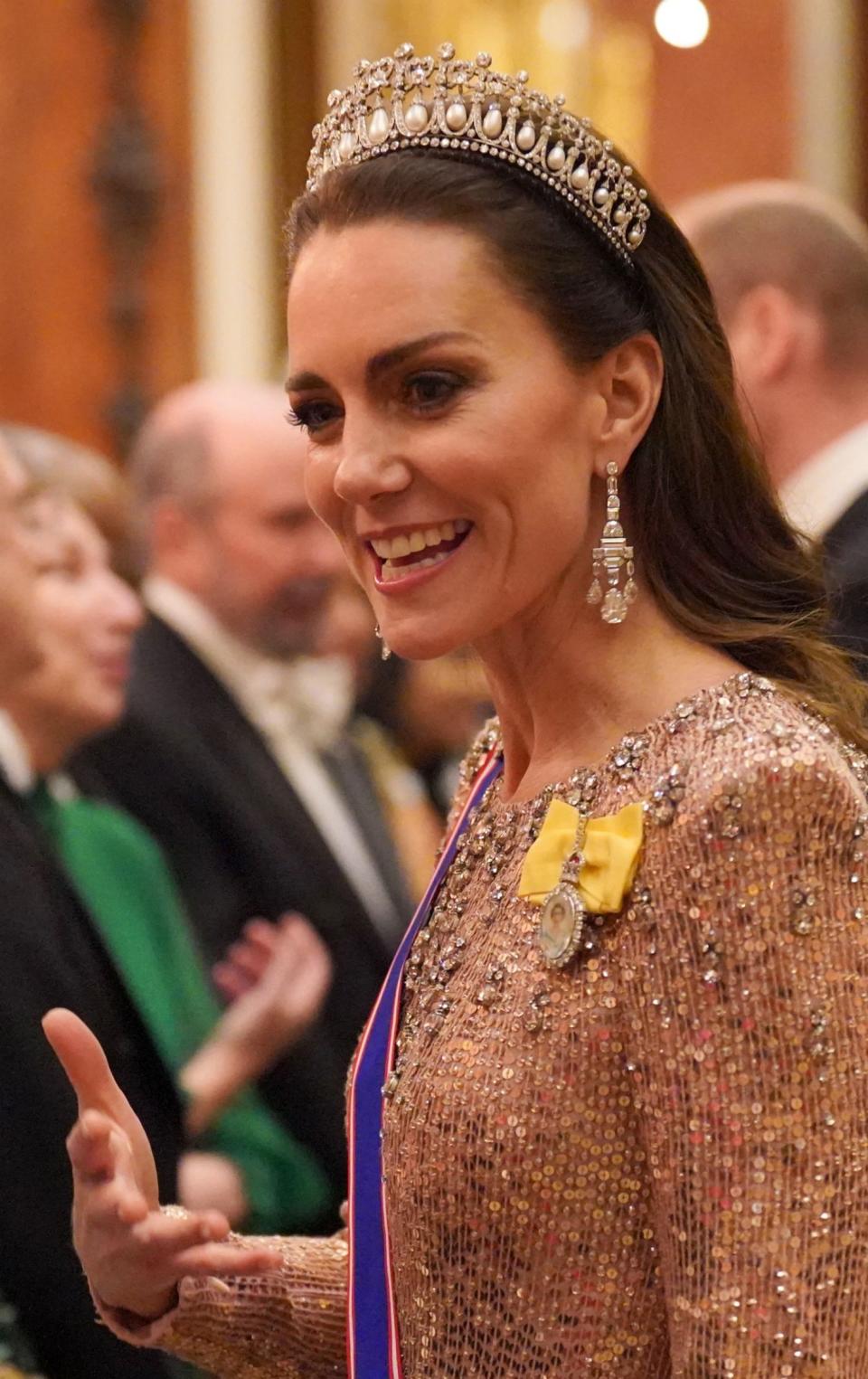 The Princess of Wales wearing the Lover's knot tiara and Queen Elizabeth's Cartier earrings