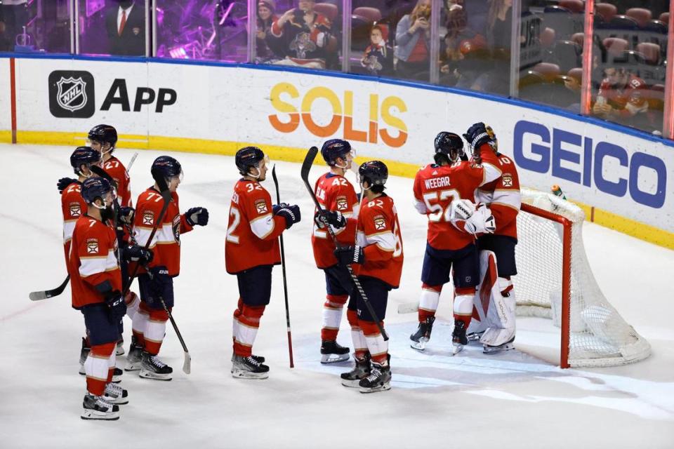 Florida Panthers players celebrate their 4-1 win over the Vegas Golden Knights during an NHL game at the FLA Live Arena on Thursday, January 27, 2022 in Sunrise, Fl.