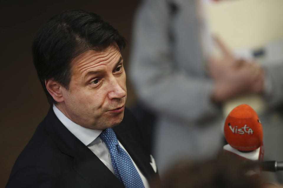 Italian Prime Minister Giuseppe Conte speaks with the media as he arrives for an EU summit in Brussels, Thursday, March 21, 2019. British Prime Minister Theresa May is trying to persuade European Union leaders to delay Brexit by up to three months, just eight days before Britain is scheduled to leave the bloc. (AP Photo/Francisco Seco)