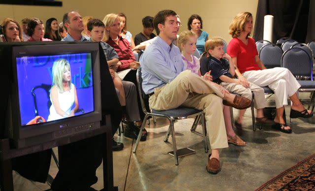 AP Photo/John Russell Members of Remnant Fellowship listen to Gwen Shamblin Lara