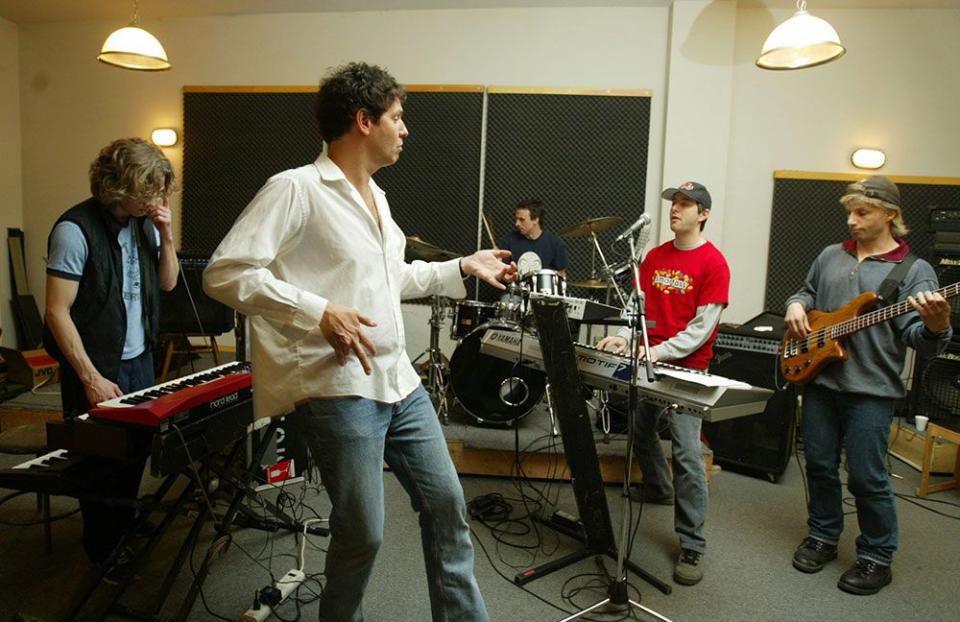  Craig Martin leads a rehearsal of his band of musicians in 2003.