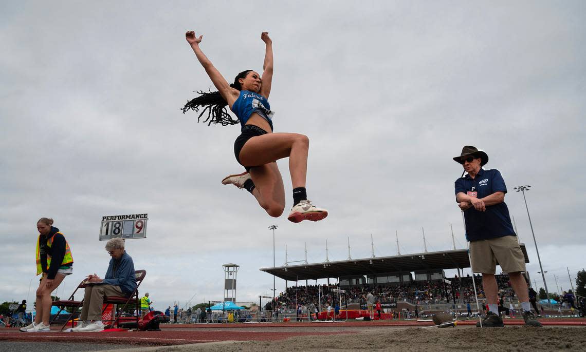 Federal Way’s Cassandra Atkins sets sail en route to a state title in the 4A girls long jump competition during the final day of the WIAA state track and field championships at Mount Tahoma High School in Tacoma, Washington, on Friday, May 26, 2023. Tony Overman/toverman@theolympian.com