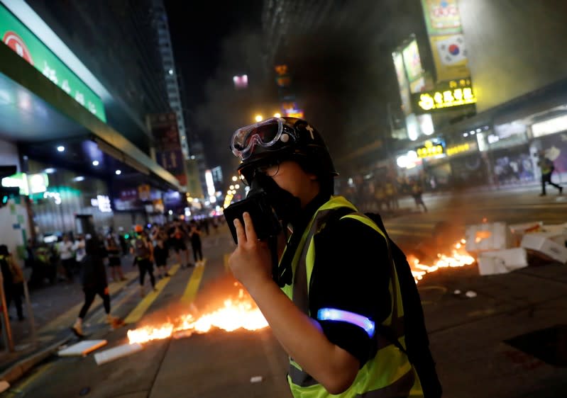 The Wider Image: Sermons with saline: Hong Kong pastor offers aid and prayers