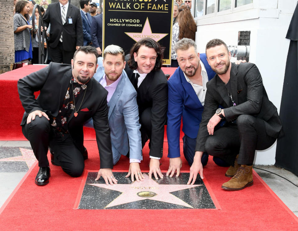 NSync — Chris Kirkpatrick, Lance Bass, JC Chasez, Joey Fatone, and Justin Timberlake — reunite for their Hollywood Walk of Fame ceremony. (Photo: Steve Granitz/WireImage)