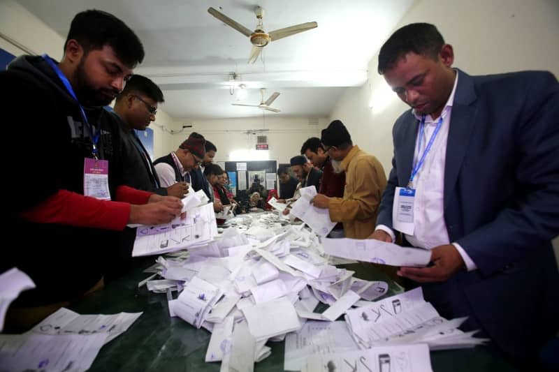 Election officials count ballots after polls closed during the 12th national general election in Bangladesh. Prime Minister Sheikh Hasina is guaranteed to serve a fifth term in office following a boycott led by an opposition party she branded a "terrorist organisation." Habibur Rahman/ZUMA Press Wire/dpa