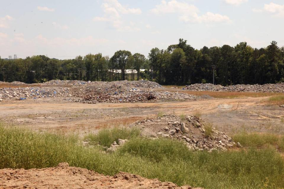 Blasted rocks is all that remains of the former Panthers training facility site off Palmetto Parkway. The stretch of road is not yet open to the public.