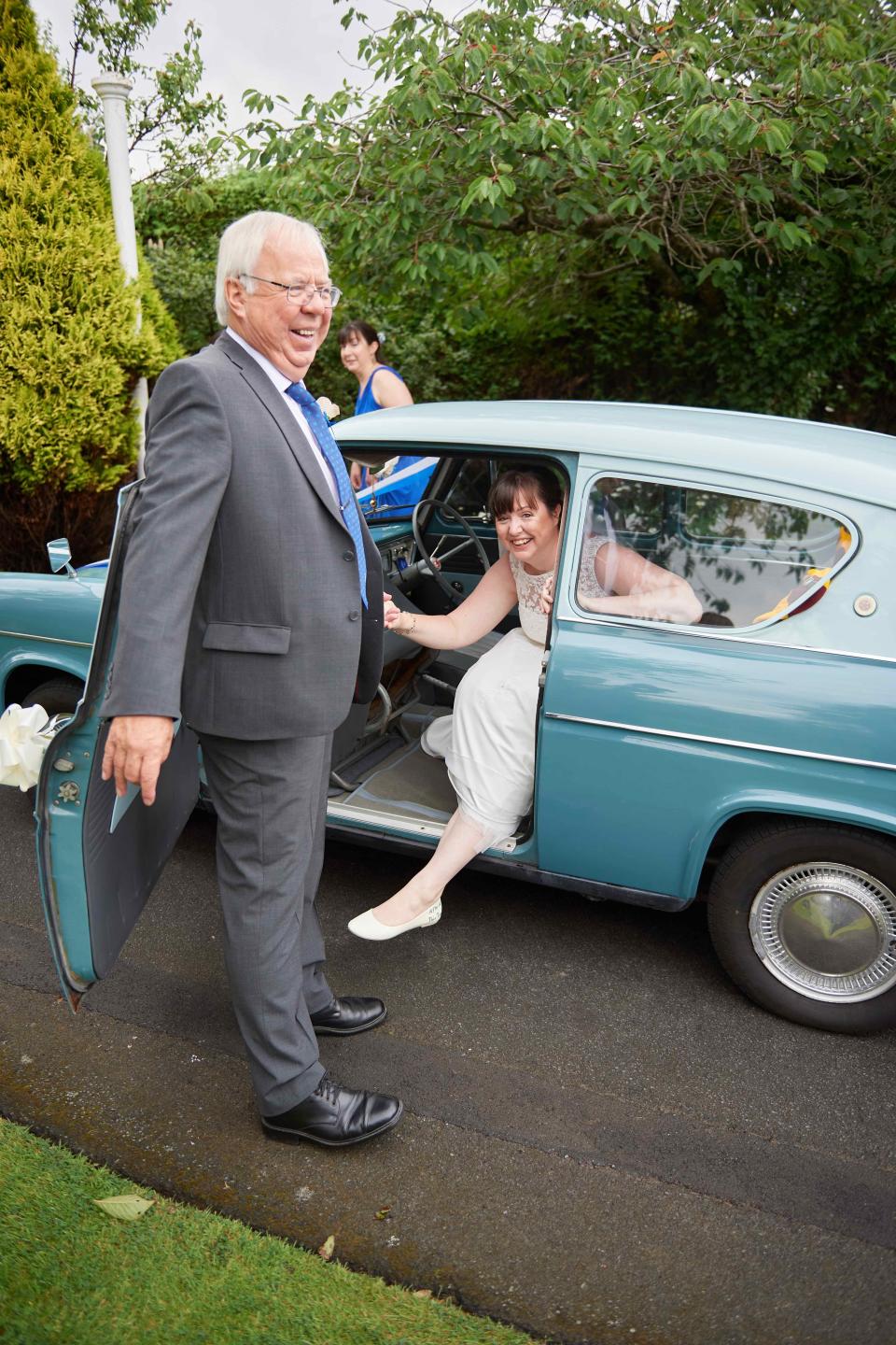 Amy Fieldhouse-Downes and her father, pictured with her Harry Potter wedding car. (Matthew Sier)