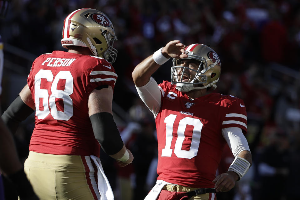 San Francisco 49ers quarterback Jimmy Garoppolo (10) celebrates a play offensive guard Mike Person (68) during the first half of an NFL divisional playoff football game against the Minnesota Vikings, Saturday, Jan. 11, 2020, in Santa Clara, Calif. (AP Photo/Marcio Jose Sanchez)
