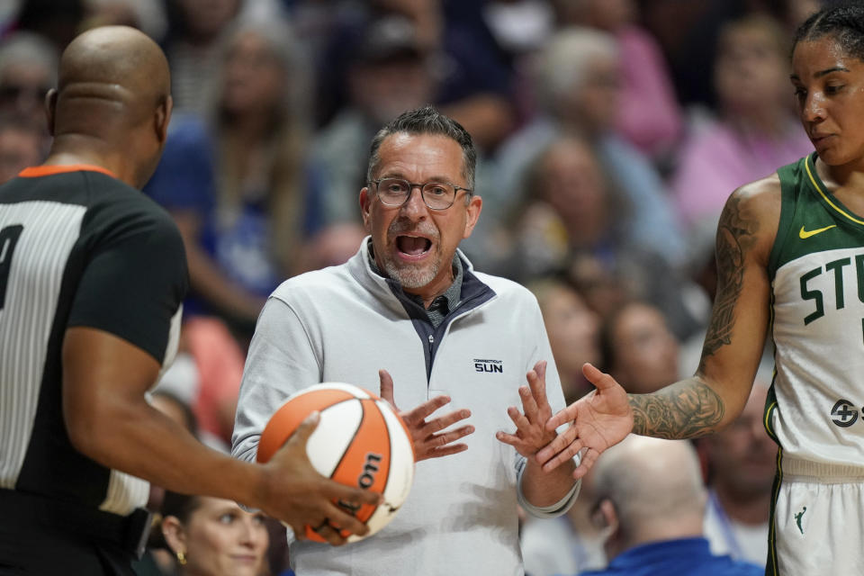 Connecticut Sun coach Curt Miller disputes a call during the second half of the team's WNBA basketball game against the Seattle Storm, Thursday, July 28, 2022, in Uncasville, Conn. (AP Photo/Bryan Woolston)