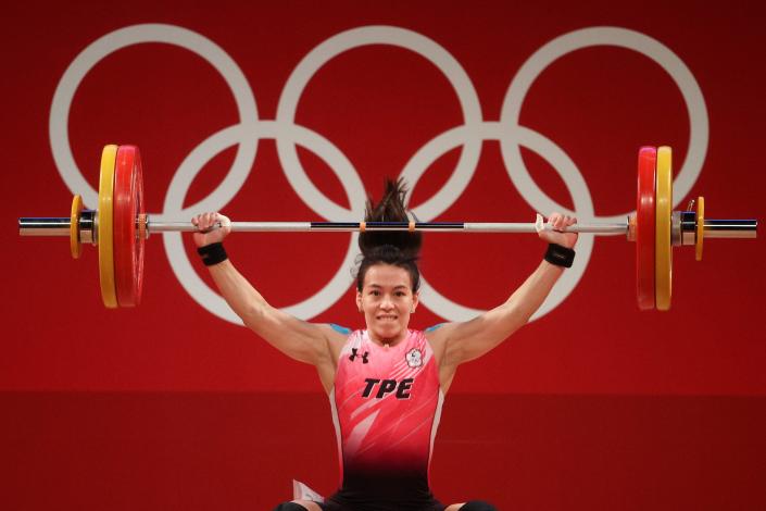 Hsing-Chun Kuo of Team Chinese Taipei competes during the Weightlifting - Women&#39;s 59kg event at the Tokyo Olympics.
