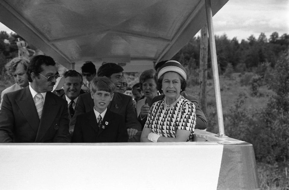 Prince Edward with brother Andrew behind him, and the Queen in Quebec in 1976 (J. Walter Green/AP)