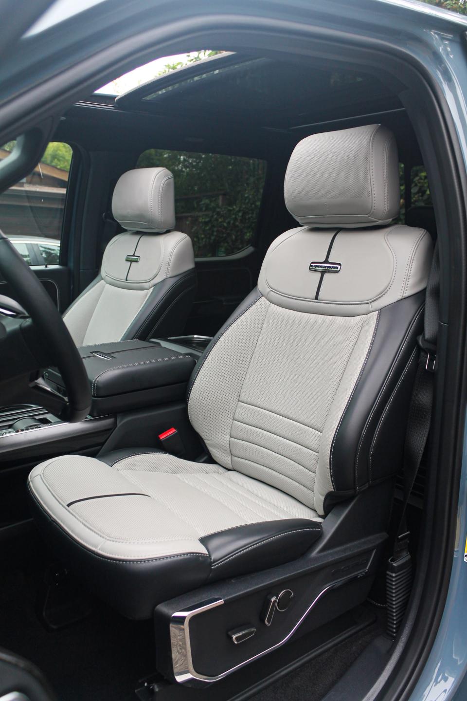 The light grey and black front seats of the F-150 Lightning electric pickup truck.