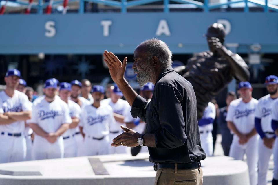 David Robinson, son of Jackie Robinson, speaks to Los Angeles Dodgers players and staff on Friday afternoon - the 75th anniversary of his father breaking MLB's color barrier.